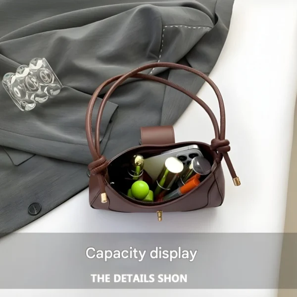 Fashion adjustable shoulder bag made of PU leather for daily use in brown.