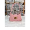 Fashion adjustable shoulder bag made of PU leather for daily use in pink.