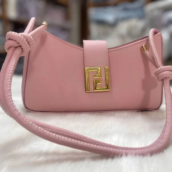 Adjustable shoulder bag for women made of PU leather with fashion design for everyday use in pink