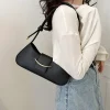 "Black PU leather shoulder bag with zipper closure for everyday use outfit"