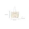 Large-capacity bow tote bag made of PU leather, fashionable design for daily use in white.