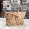 Large-capacity bow tote bag made of PU leather, fashionable design for daily use in khaki.