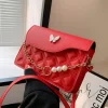 Red PU mini shoulder bag with butterfly decor and quilted embossed design for casual outings