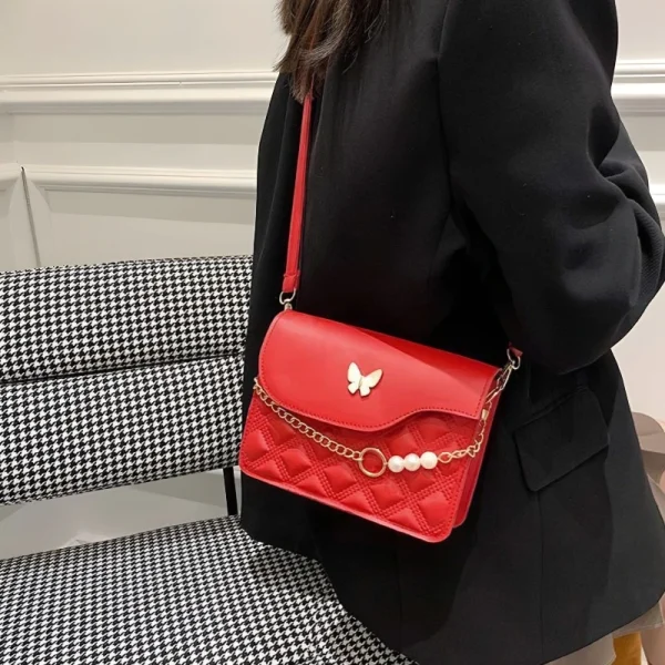 Red PU mini shoulder bag with butterfly decor and quilted embossed design for casual outings