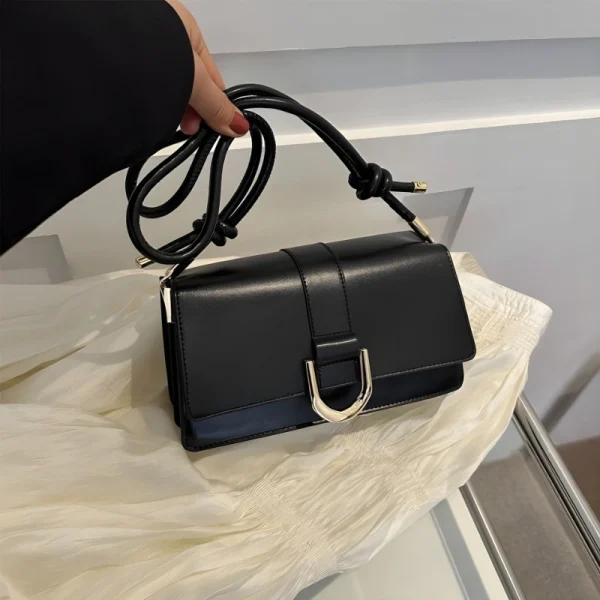 "Black PU leather casual shoulder bag with buckle flap design for everyday use"