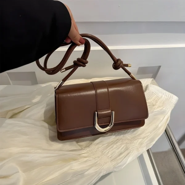 "Brown PU leather casual shoulder bag with buckle flap design for everyday use"