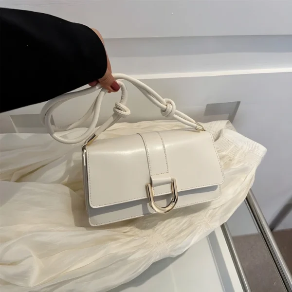 "White PU leather casual shoulder bag with buckle flap design for everyday use"