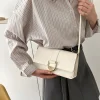 "White PU leather casual shoulder bag with buckle flap design for everyday use outfit"