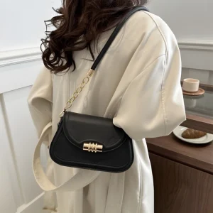 "PU leather commuter crossbody bag with metal lock for daily use in black outfit"