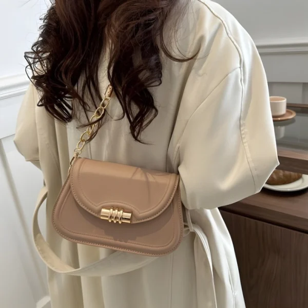 "PU leather commuter crossbody bag with metal lock for daily use in khaki outfit"
