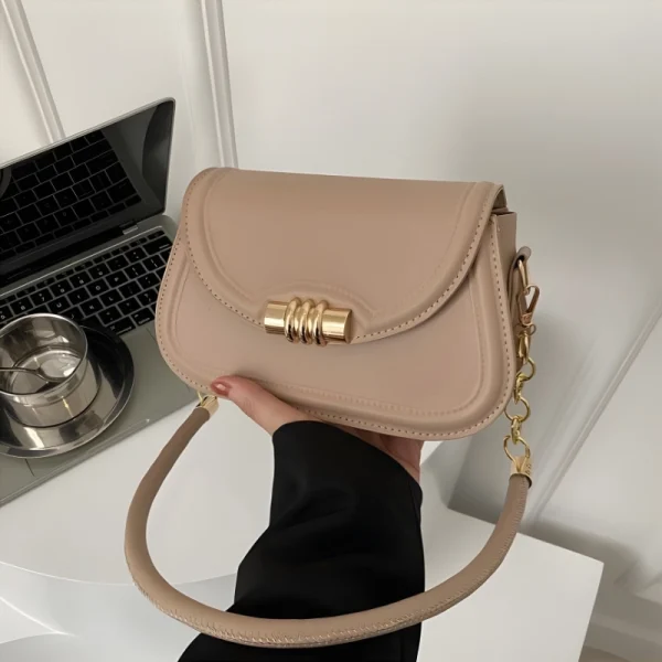 "PU leather commuter crossbody bag with metal lock for daily use in khaki outfit"