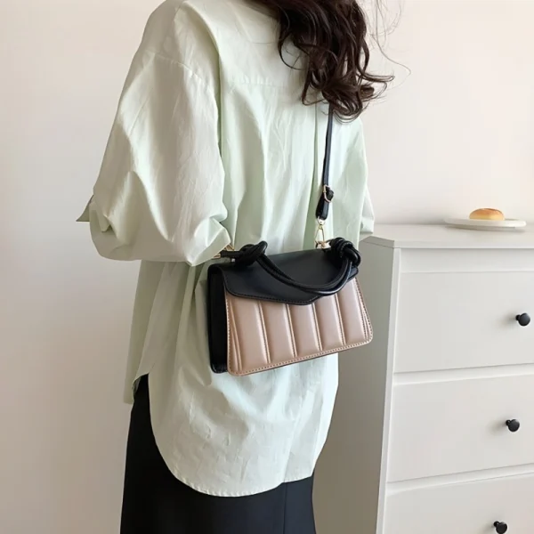 Women's fashion handbag made of PU leather with knotted handle, ideal for daily use in black and brown color