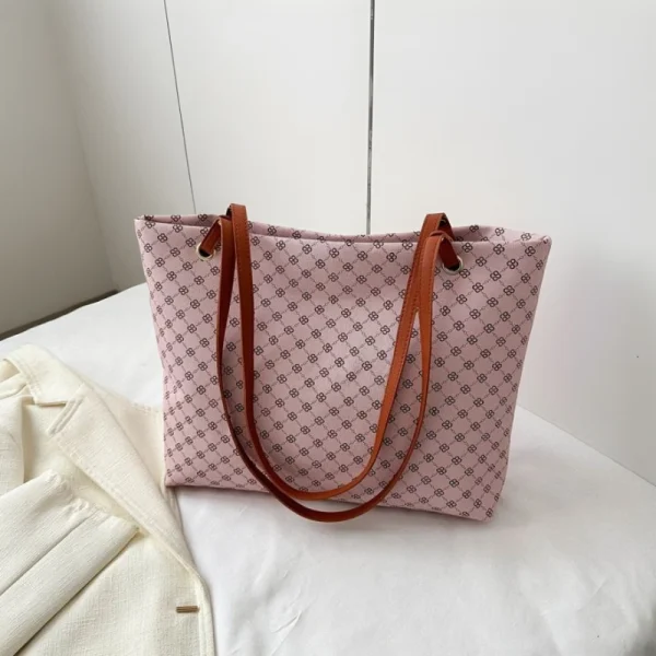 "Geometric pattern tote bag made of PU leather with waterproof build for daily use in pink"