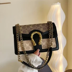 “Golden chain shoulder bag made of PU leather with premium fashion detailing for daily use in black.”