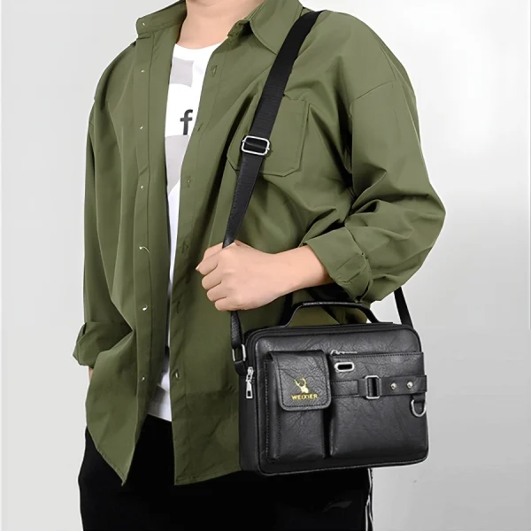 “Men's leather shoulder bag made of PU leather with multi-pocket design for business and travel use in black outfit.”