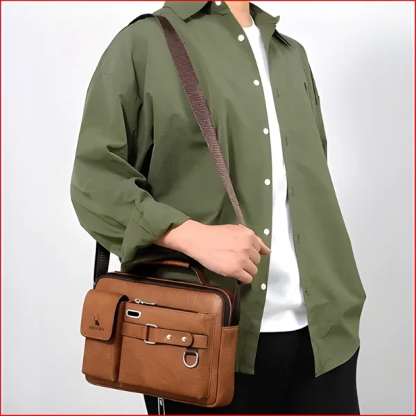 “Men's leather shoulder bag made of PU leather with multi-pocket design for business and travel use in light brown outfit.”