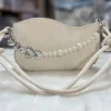 Pearl chain crossbody bag for women made of soft PU with stylish design for casual and evening use in off white