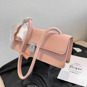 Pink PU leather baguette bag with hardware lock and flap closure for shopping and everyday use
