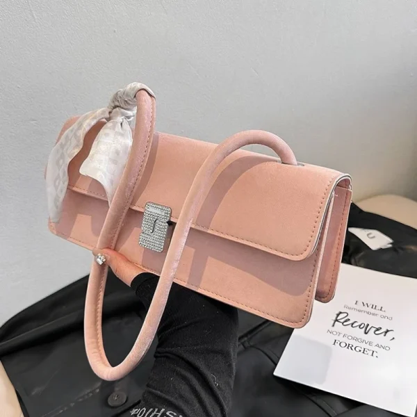Pink PU leather baguette bag with hardware lock and flap closure for shopping and everyday use