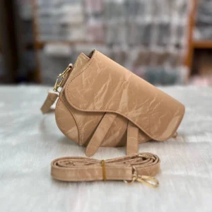 “PU leather saddle bag with zipper closure in orange, ideal for daily use and medium-size essentials.”