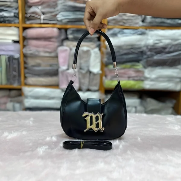Retro underarm shoulder bag for women made of PU leather with metal lock, perfect for versatile use in black.