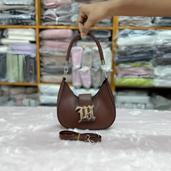 Retro underarm shoulder bag for women made of PU leather with metal lock, perfect for versatile use in brown.