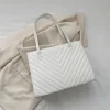 "Simple tote bag made of PU leather with quilted design for daily use in white"