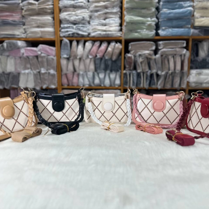 Trending women’s crossbody bag made of PU leather with braided strap and square pattern, ideal for daily use in multicolor.