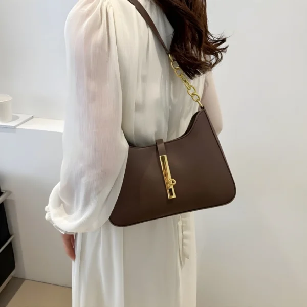 “PU leather hobo shoulder bag with buckle and chain design for daily use in brown.”