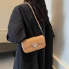 PU leather underarm shoulder bag with hasp closure for daily use in tan outfit