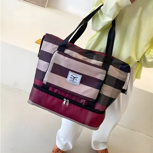 “Waterproof travel sports bag made of lightweight nylon with strong build for shopping and gym use in maroon.”
