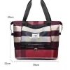 “Waterproof travel sports bag made of lightweight nylon with strong build for shopping and gym use in maroon.”