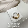 "White PU leather baguette bag with metal donut decor for casual everyday use"