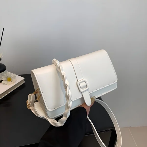 White faux leather crossbody shoulder bag with buckle strap for casual everyday use