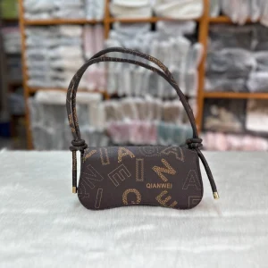 Women's crossbody bag made of PU leather with knot-style handle for trendy daily use in coffee & brown color