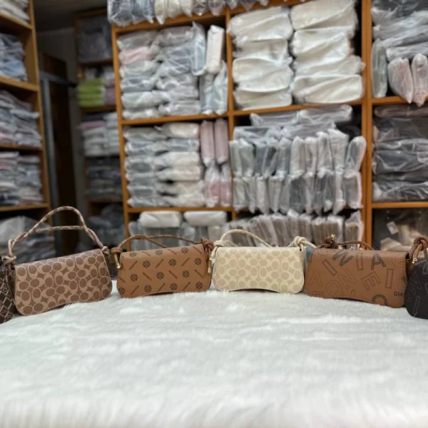 Women's crossbody bag made of PU leather with knot-style handle for trendy daily use in multi color