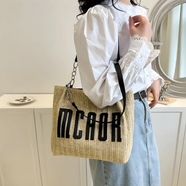 "Braided fabric women’s shoulder bag outfit with lightweight braided texture for casual use in black"