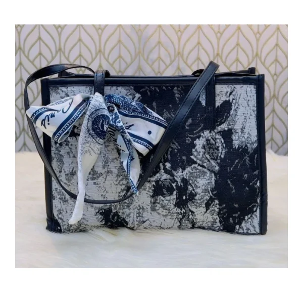 “Trendy women’s shoulder bag made of cloth with stylish graffiti design for casual everyday outings in black graffiti color”