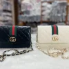 “Women’s PU shoulder bag with compact design for everyday use in black and white display”