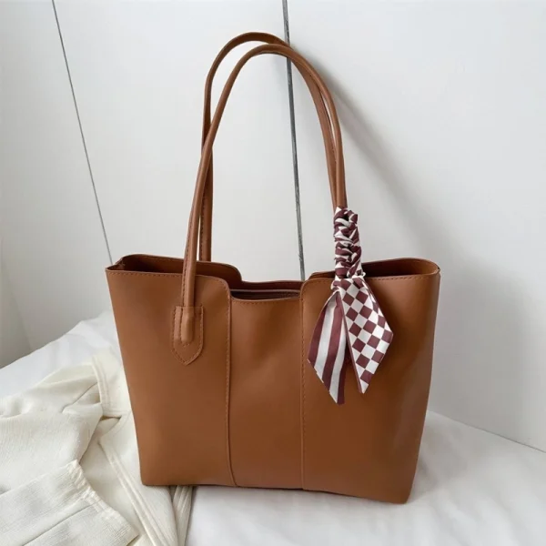 Women’s PU leather tote bag with large capacity for everyday use in brown color