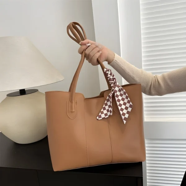Women’s PU leather tote bag with large capacity for everyday use in brown color