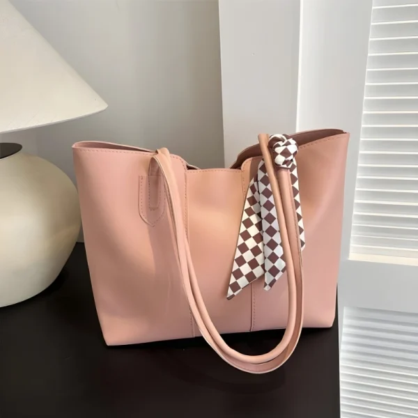 Women’s PU leather tote bag with large capacity for everyday use in soft pink color