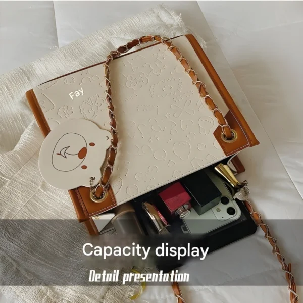 Women's shoulder bag made of PU leather with a spacious functional design for everyday use in brown