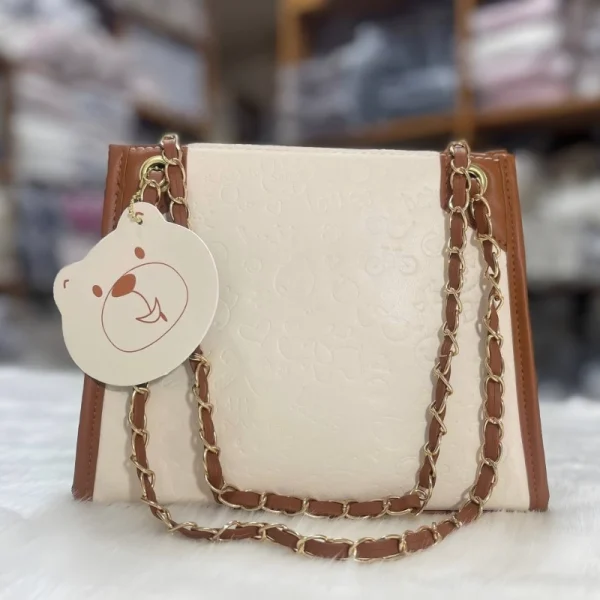 Women's shoulder bag made of PU leather with a spacious functional design for everyday use in brown