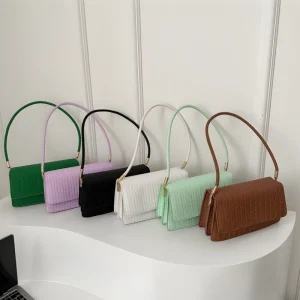 “Woven PU leather shoulder baguette bag for women with flap closure for daily, casual and party use in multicolor.”