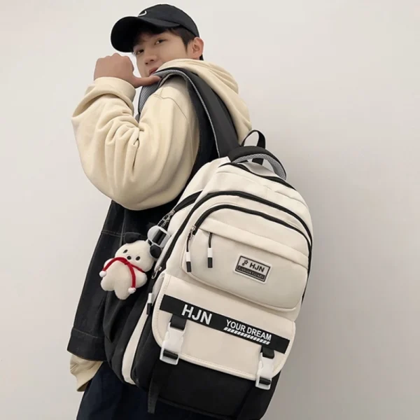“Academy style school backpack made of Oxford and nylon with lightweight large capacity for daily school use in black outfit.”