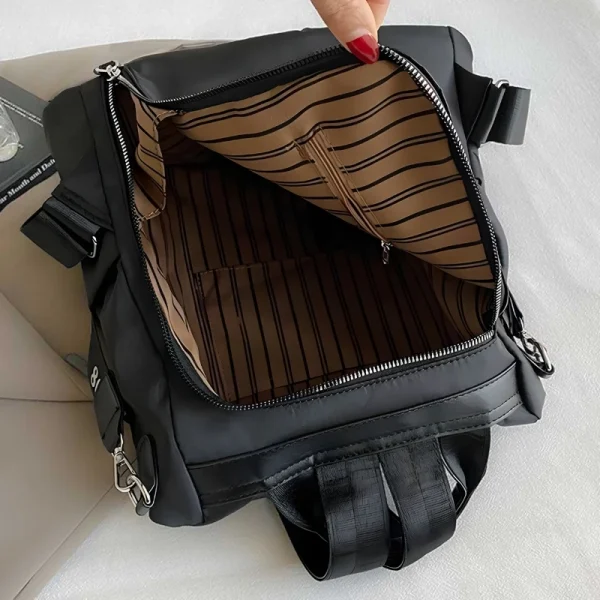 “Anti-theft women’s backpack and crossbody bag made of lightweight Oxford cloth for multi-purpose outdoor use in black capacity.”