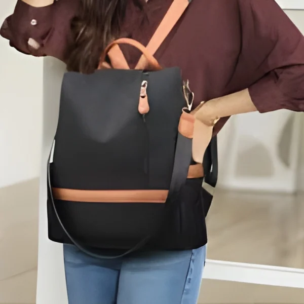 “Women outdoor tote bag made with durable nylon, featuring large capacity for daily use and travel in orange and black outfit.”