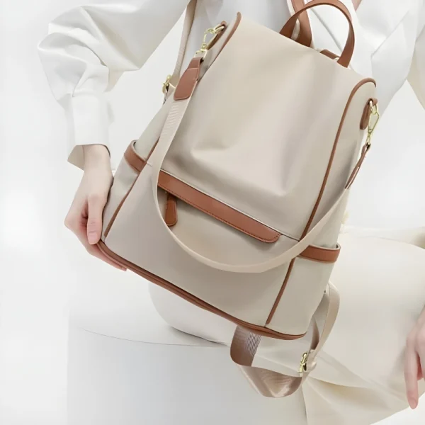 “Women waterproof Oxford backpack with anti-theft design and multi-pocket storage for travel and daily use in off white front.”